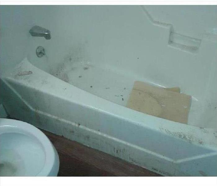 Bathtub with debris in it from contracting work