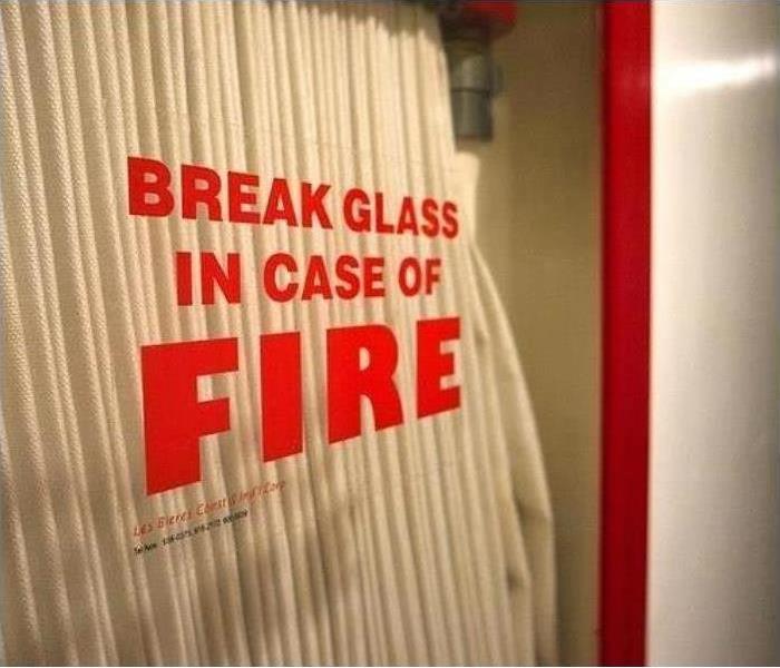 Breaking Glass in Case of Fire written on glass